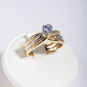 Anello tre ori 18k con diamante 0,25ct