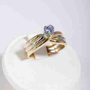 Anello tre ori 18k con diamante 0,25ct